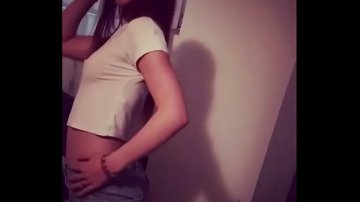 Teenager with appetizing tits dances front room