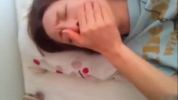 young Chinese woman sucks boyfriend's cock while being filmed